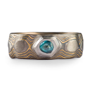Guri Bori carved ring with a blue sapphire set in an organic setting of palladium metal. super modern and contemporaryheirloom ring. Todd reed would be jealous 