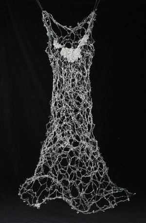 Patinaed copper wire which has been hand woven with glass and resin. Wire Dress Sculpture