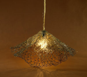 Woven brass wire looped light shade funnel shaped with a single bulb from a wire adorned white cord, Lighting, home decor, interior design