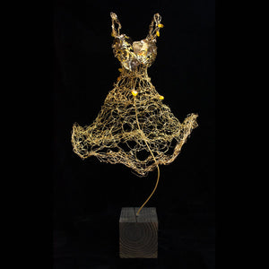 Thin gold woven wire dress sculpture on stand with butterflies and amber gemstones
