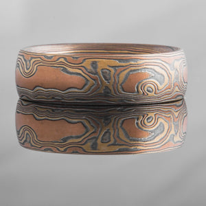 Artisan Mokume Gane Ring or Wedding Band in Woodgrain Pattern and Fire Palette with Etch and Oxidized Finish
