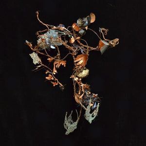 Mixed media sculpture Botanical shapes cut from copper metal sheet attached to wire vines with swooping wire birds