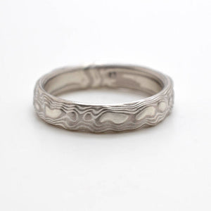small mokume gane patterned band in guri bori pattern, metals used are silver and palladium