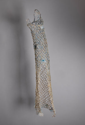 Light blue metallic gradient to champagne gold at bottom. Wire art sculpture cylinder net woven artisan, home decor, interior design