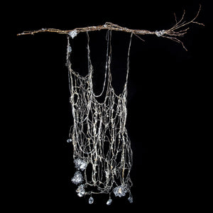 silver metal wire woven tapestry hanging from silver branches sculpture metallic artisan