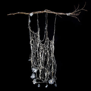Small scale silver metal wire woven tapestry hanging from silver branches sculpture metallic artisan