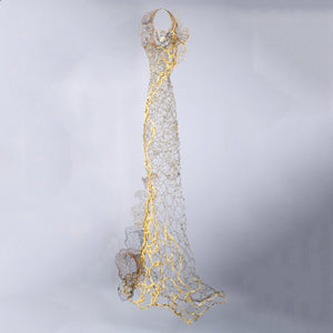 Very long flowing skinny gold wire dress sculpture thick woven gold textile accent running from top to bottom with metal flower accents, home decor, interior design
